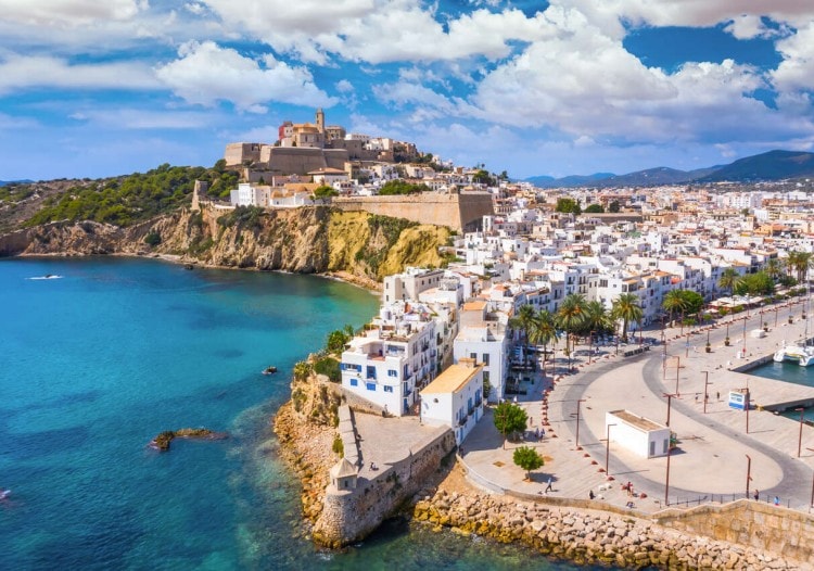 Ibiza’s white buildings and fortified old town above the sea.